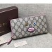 Gucci zip around wallet with embroidered face 431392 pink