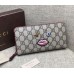 Gucci zip around wallet with embroidered face 431392 red