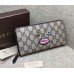 Gucci zip around wallet with embroidered face 431392 black